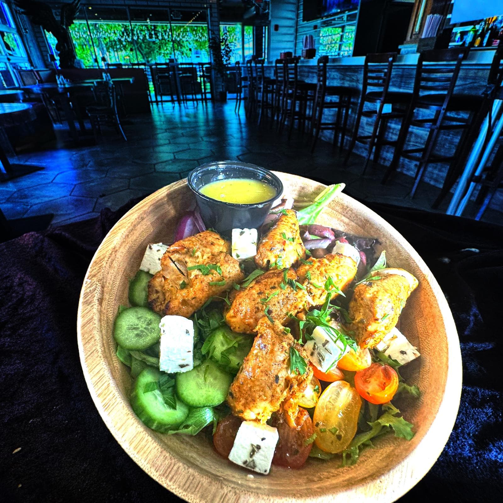 Greek Bowl with grilled chicken, feta, cucumber, tomato, and red onion at Mediterra Houston